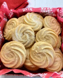 Danish Butter Cookies in a tin with red tissue paper.