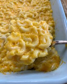 A casserole dish full of cheesy Macaroni and Cheese