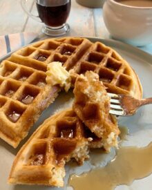 Buttermilk Waffles with a forked bite.