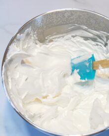 A mixing bowl full of seven minute frosting.