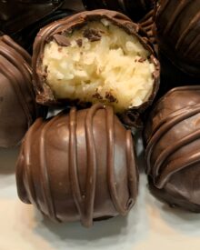 Coconut Bon Bons with a bite out of one.