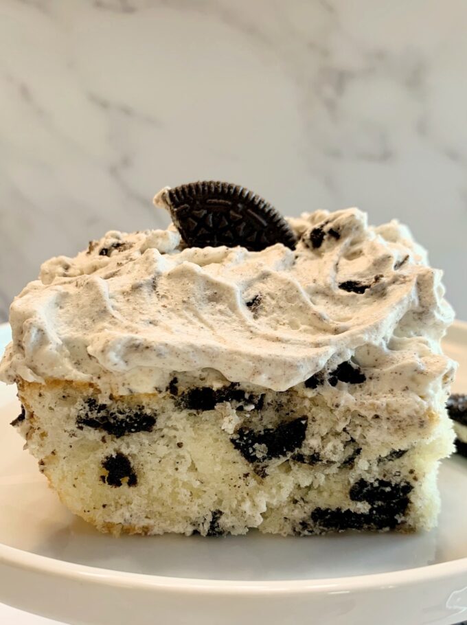 A slice of Cookies and Cream sheet cake on a plate.