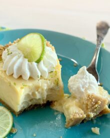 A slice of Key Lime Pie with a bite out.