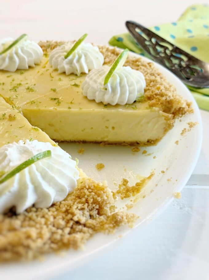 A Key Lime Pie with a slice out.