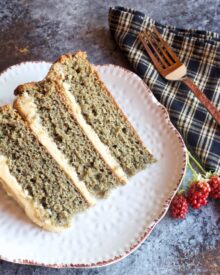 A slice of homemade blackberry jam cake with caramel icing.