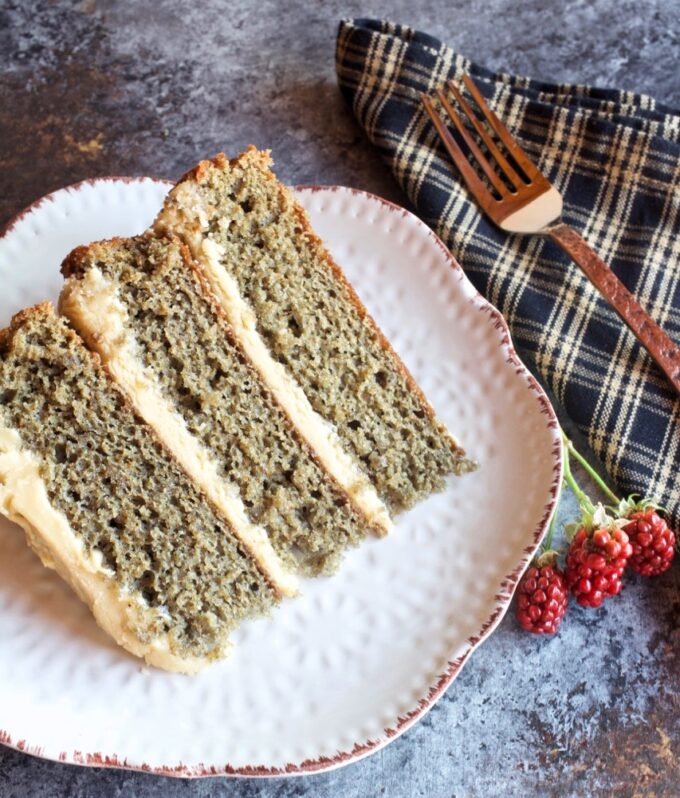 A slice of homemade blackberry jam cake with caramel icing.