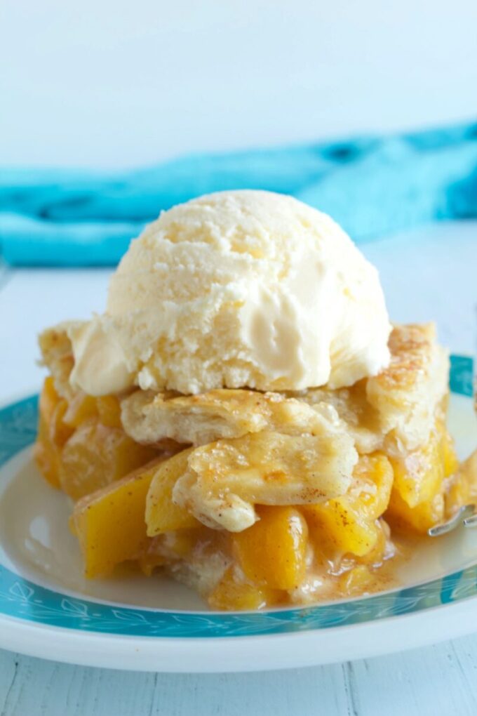 A slice of lattice topped peach pie.