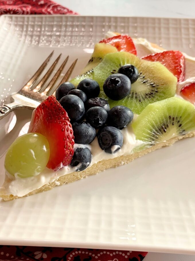 A slice of fruit pizza.