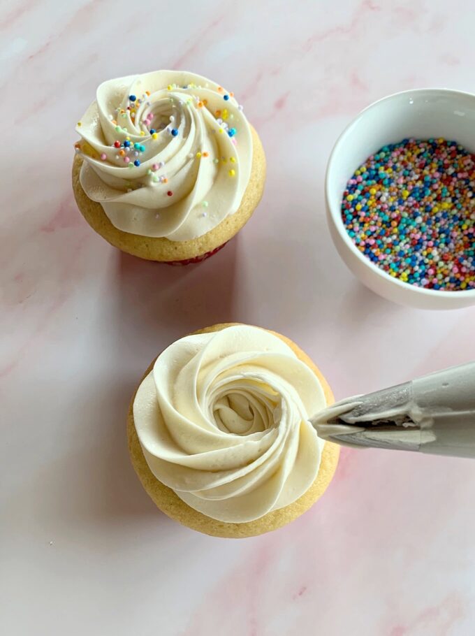 Cream cheese frosting on a cupcake.