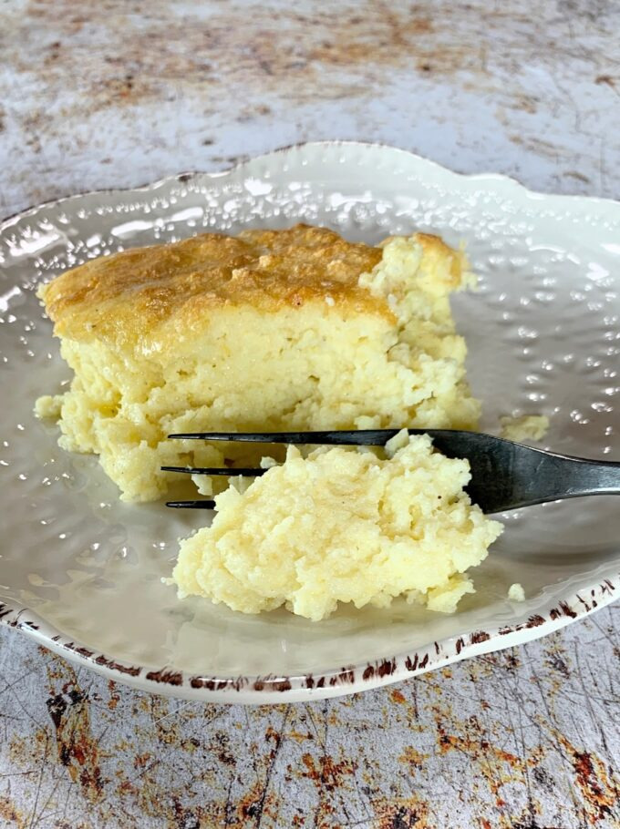 A forked serving of southern spoonbread.