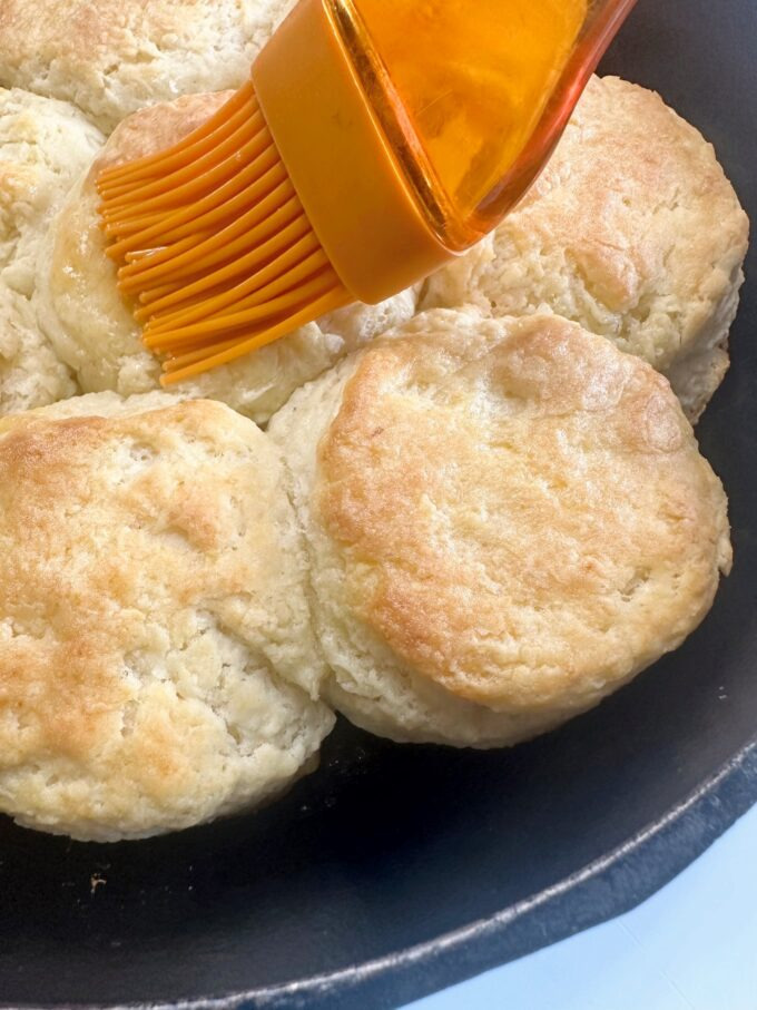 A skillet of big fluffy buttermilk biscuits.